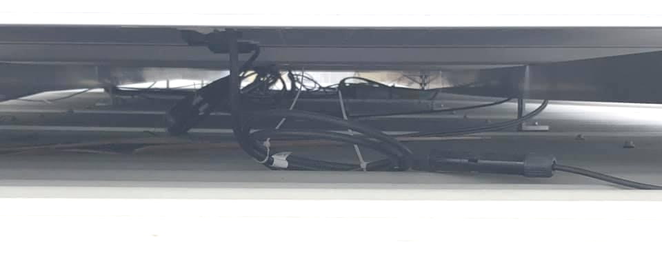 Poor Quality Workmanship on a Cheap Solar Installation. Dangerous High Voltage Cable are Left Exposed on the Roof.